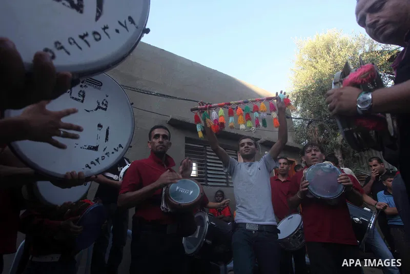 Palestinian friends and relatives celebrated the groom, Salah Khatab 25 years old, in ,Dear El-Balah, southern Gaza Strip on the eve of his wedding on August. 25, 2012, during the traditional celebration, Khatab was firs...