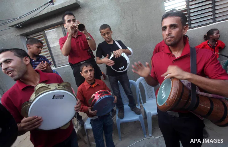 Palestinian friends and relatives celebrated the groom, Salah Khatab 25 years old, in ,Dear El-Balah, southern Gaza Strip on the eve of his wedding on August. 25, 2012, during the traditional celebration, Khatab was firs...