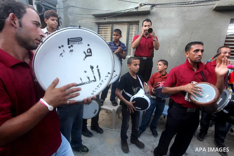 Palestinian friends and relatives celebrated the groom, Salah Khatab 25 years old, in ,Dear El-Balah, southern Gaza Strip on the eve of his wedding on August. 25, 2012, during the traditional celebration, Khatab was firs...