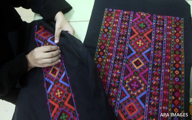 Deaf Palestinian women work on embroidery at Atfaluna Society for Deaf Children in Gaza City, on Aug. 26, 2012. The society provides services for about 15,000 deaf youth on education, training programs and income generat...