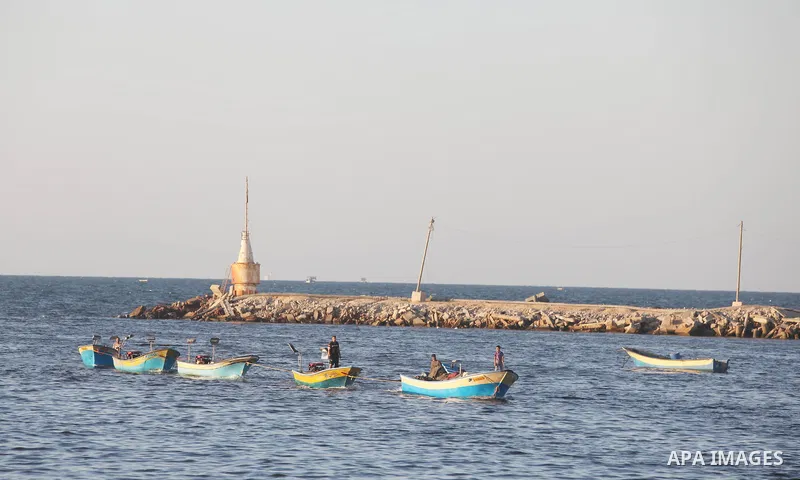 Palestinian fishermen work on their boats at the port of Gaza city on Aug 26, 2012. The ship Estelle, which leads the Freedom Flotilla will reach the Gaza port from San Sebastian, Basque Country, northern Spain within da...
