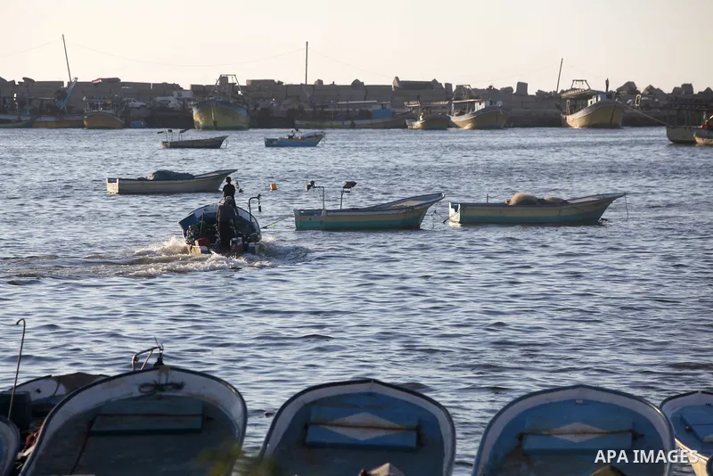 Palestinian fishermen work on their boats at the port of Gaza city on Aug 26, 2012. The ship Estelle, which leads the Freedom Flotilla will reach the Gaza port from San Sebastian, Basque Country, northern Spain within da...