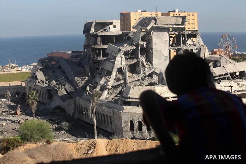 Palestinians inspect the damage at a Hamas training camp following an Israeli airstrike in Gaza City, early Tuesday, Aug. 28, 2012. Palestinian militants fired rockets towards Israel on Monday. Photo by Majdi Fathi