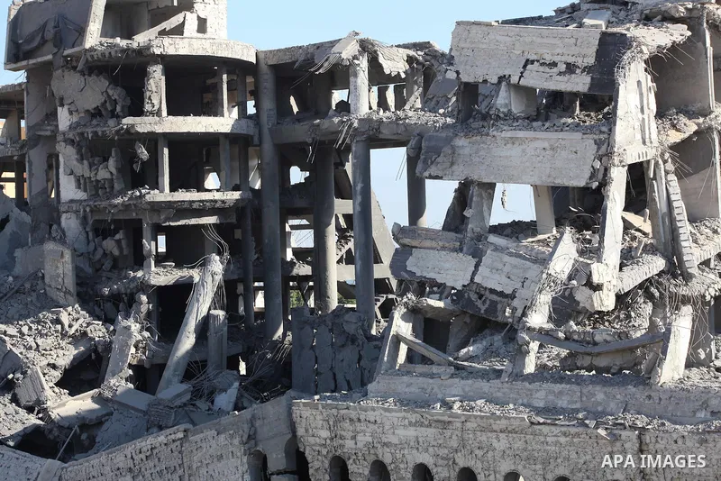 Palestinians inspect the damage at a Hamas training camp following an Israeli airstrike in Gaza City, early Tuesday, Aug. 28, 2012. Palestinian militants fired rockets towards Israel on Monday. Photo by AshrAF Amra