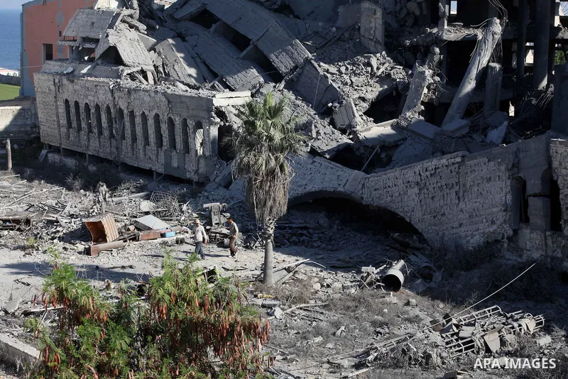 Palestinians inspect the damage at a Hamas training camp following an Israeli airstrike in Gaza City, early Tuesday, Aug. 28, 2012. Palestinian militants fired rockets towards Israel on Monday. Photo by AshrAF Amra