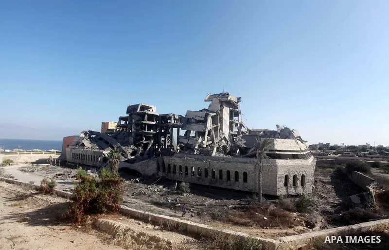Palestinians inspect the damage at a Hamas training camp following an Israeli airstrike in Gaza City, early Tuesday, Aug. 28, 2012. Palestinian militants fired rockets towards Israel on Monday. Photo by AshrAF Amra
