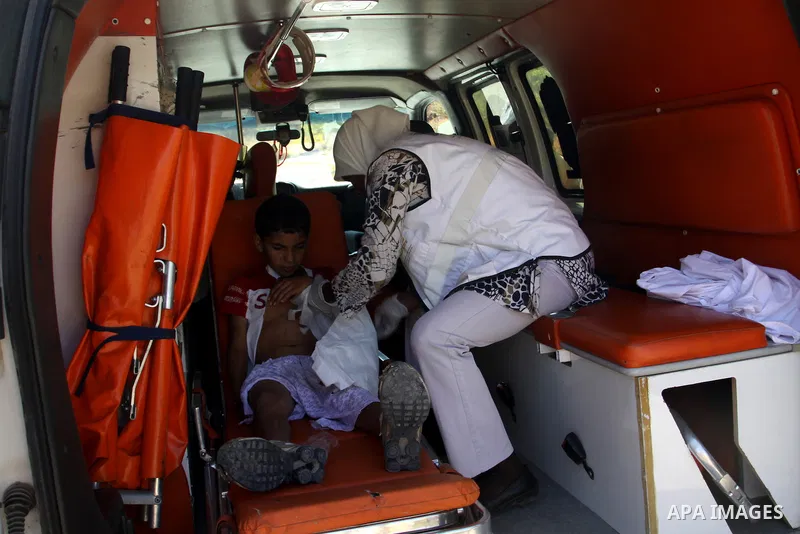 Palestinian medical workers carry wounded boy to an ambulance after Jewish settlers from the Israeli settlement of Livona attacked his familly house at Al - Loban Village near the west Bank City of Nablus on 28 August 20...