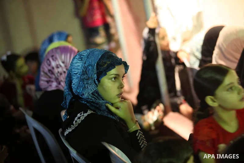 Palestinians listen to sufis songs performed by Sufi artists during celebration in Gaza city on Aug 28, 2012. Mystic songs symbolizing peace, brotherhood and love. Photo by Majdi Fathi