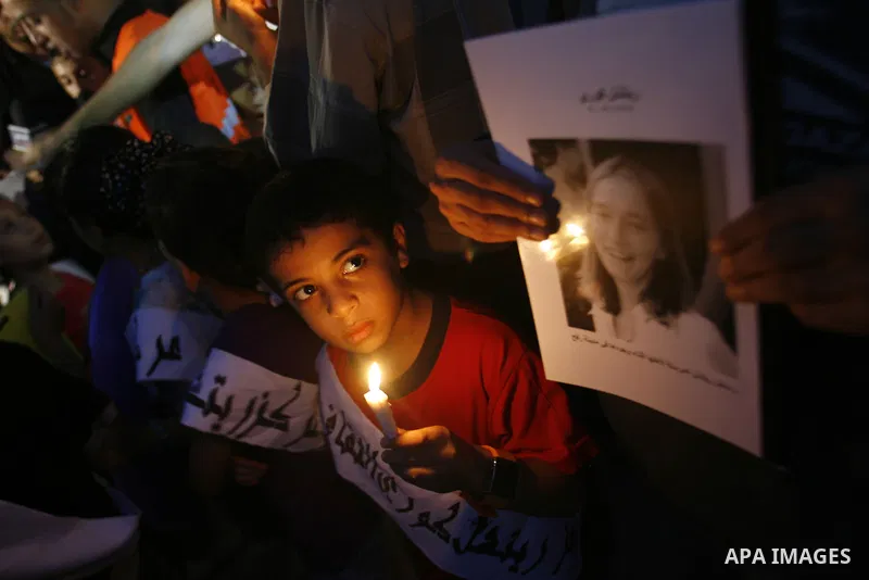 Palestinian children hold candles during a protest in Rafah in the southern Gaza Strip, against an Israeli court's ruling, August 29, 2012. The Israeli court on Tuesday cleared Israel's military of any blame for the deat...