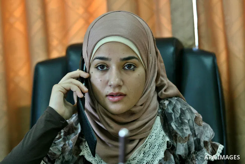 Palestinian mayor teenager Bashaer Othman, 15, sits behind her desk at the town hall of the West Bank village of Allar, north of Tulkarem, on August 30, 2012. Othman became mayor as part of a program from Allar's municip...