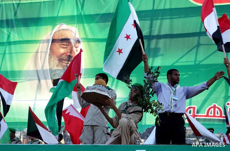 Palestinian boy scouts hold Islamic countries flags during a festival entitled "Jerusalem in our eyes"organized by Hamas movement, marking the 43rd anniversary of burning down al-Aqsa mosque in Gaza city on 30 Aug 2012....