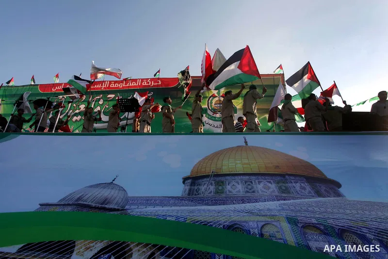 Palestinian boy scouts hold Islamic countries flags during a festival entitled "Jerusalem in our eyes"organized by Hamas movement, marking the 43rd anniversary of burning down al-Aqsa mosque in Gaza city on 30 Aug 2012....
