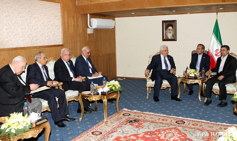Palestinian President Mahmoud Abbas (L) meets with Iranian President Mahmoud Ahmadinejad on the sidelines of the Non-Aligned opening in Tehran, 30 August 2012. Iranian Supreme Leader Ayatollah Ali Khamenei opened the Non...
