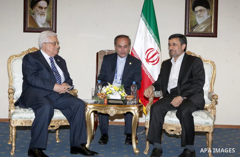 Palestinian President Mahmoud Abbas (L) meets with Iranian President Mahmoud Ahmadinejad on the sidelines of the Non-Aligned opening in Tehran, 30 August 2012. Iranian Supreme Leader Ayatollah Ali Khamenei opened the Non...