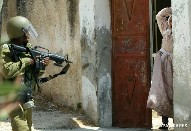 Palestinian woman attacks Israeli soldiers during clashes against the expropriation of Palestinian land by Israel in the village of Kafr Qaddum, near the West Bank city of Nablus on August 31, 2012. Photo by Nedal Eshtay...