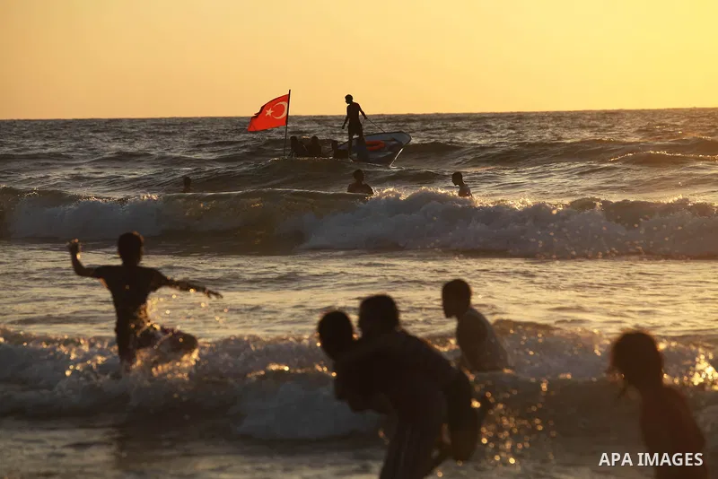 Palestinians ride a boat off the coast of Gaza during the last Friday holiday before the beginning of new school year in Gaza city, Aug 31, 2012. Next Sunday is the First day for the new school year according to Palestin...