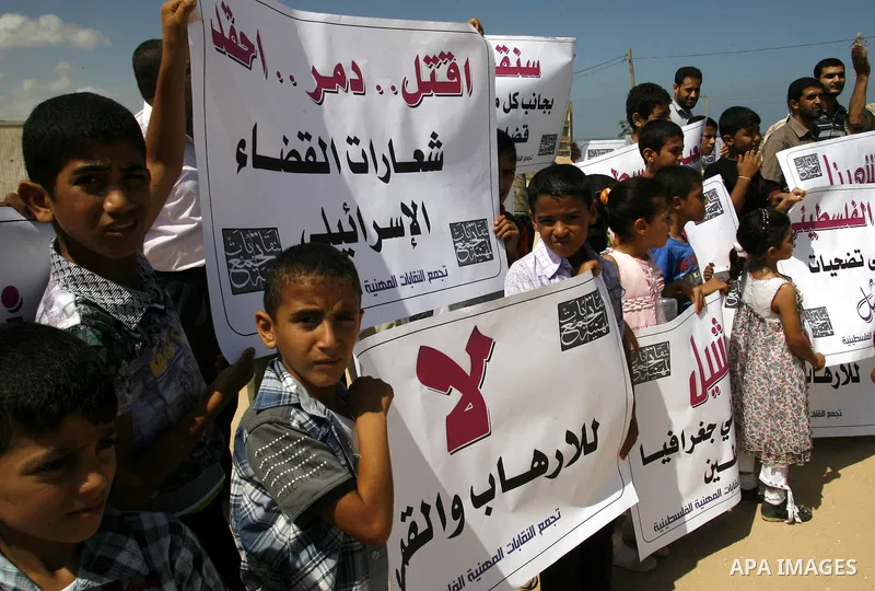 Palestinian children attend a protest calling for justice for Rachel Corrie in Rafah, Gaza Strip, Sep. 01, 2012. An Israeli court ruled that Israel did not intentionally kill pro-Palestinian activist Rachel Corrie, run o...