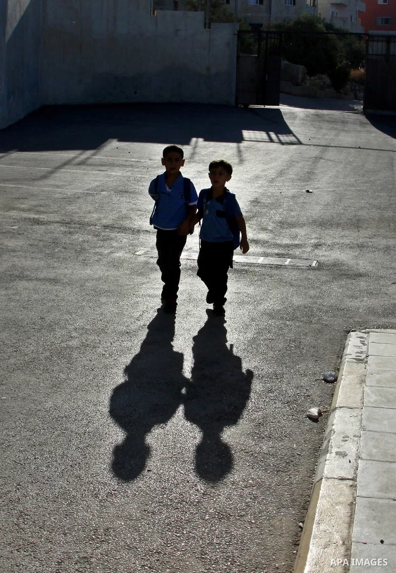 Palestinian students return back to their schools in the morning of the first day of the new year study in the West Bnak city of Nablus on Sep. 02, 2012. The academic year began in the Gaza Strip and West Bank on Sept. 0...