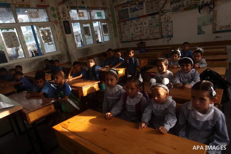 Palestinian students return back to their schools "UNRWA" in the morning of the first day of the new year study in Gaza city on Sep. 02, 2012. The academic year began in the Gaza Strip and West Bank on Sept. 02. Photo by...