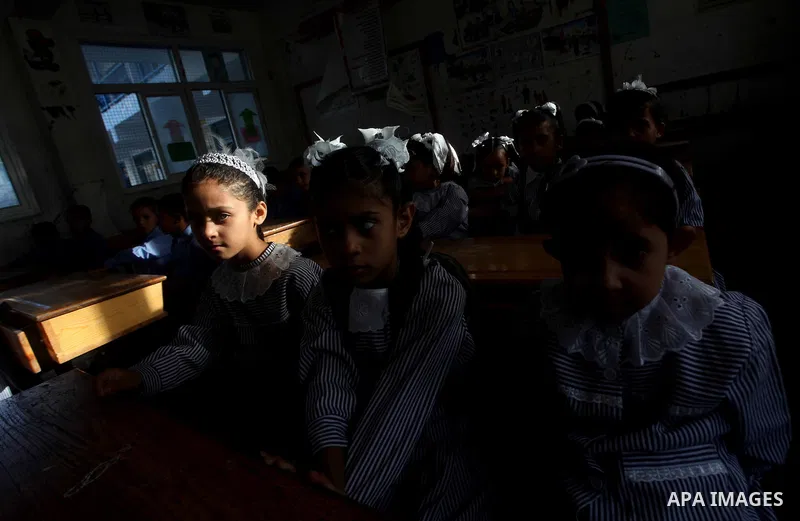 Palestinian students return back to their schools "UNRWA" in the morning of the first day of the new year study in Gaza city on Sep. 02, 2012. The academic year began in the Gaza Strip and West Bank on Sept. 02. Photo by...