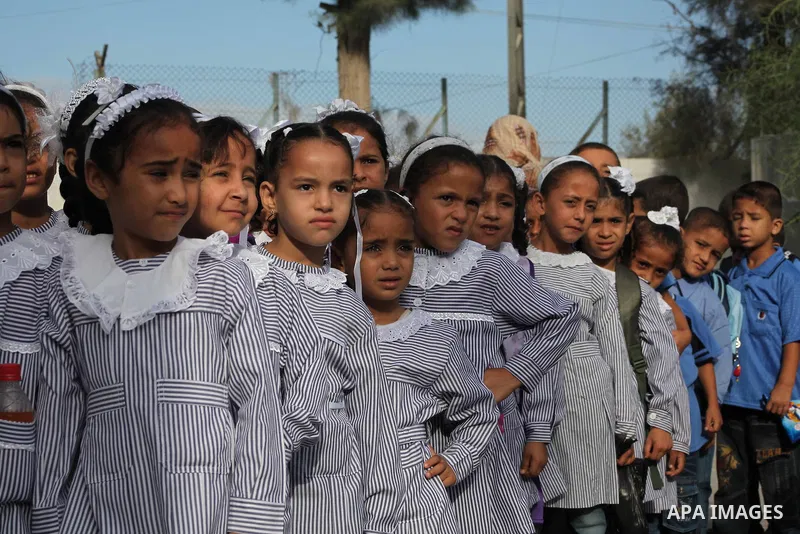 Palestinian students return back to their schools "UNRWA" in the morning of the first day of the new year study in Gaza city on Sep. 02, 2012. The academic year began in the Gaza Strip and West Bank on Sept. 02. Photo by...