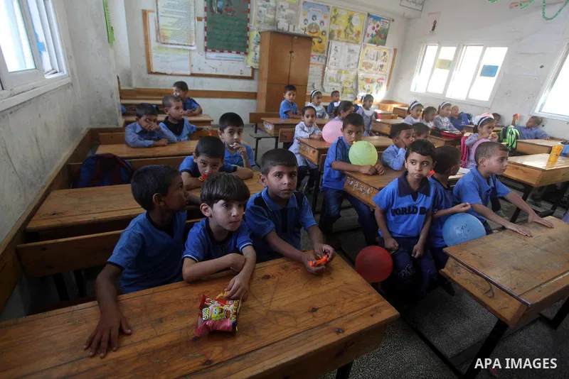 Palestinian students return back to their schools "UNRWA" in the morning of the first day of the new year study in Gaza city on Sep. 02, 2012. The academic year began in the Gaza Strip and West Bank on Sept. 02. Photo by...