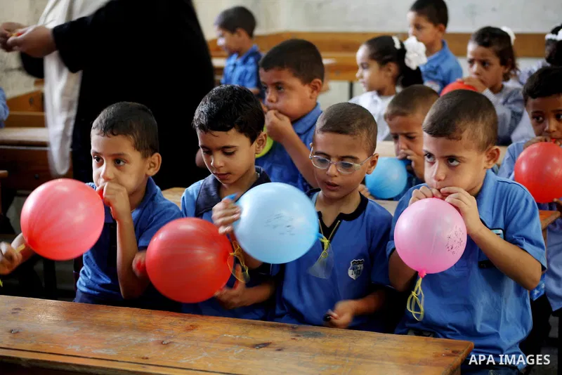 Palestinian students return back to their schools "UNRWA" in the morning of the first day of the new year study in Gaza city on Sep. 02, 2012. The academic year began in the Gaza Strip and West Bank on Sept. 02. Photo by...