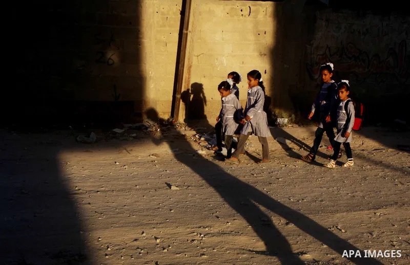 Palestinian students return back to their schools "UNRWA" in the morning of the first day of the new year study in Gaza city on Sep. 02, 2012. The academic year began in the Gaza Strip and West Bank on Sept. 02. Photo by...