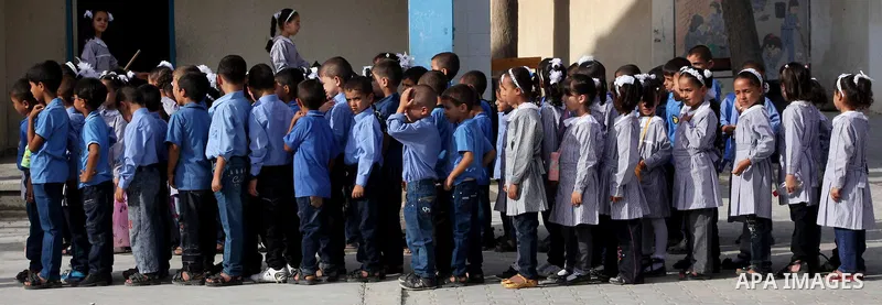 Palestinian students return back to their schools "UNRWA" in the morning of the first day of the new year study in Gaza city on Sep. 02, 2012. The academic year began in the Gaza Strip and West Bank on Sept. 02. Photo by...
