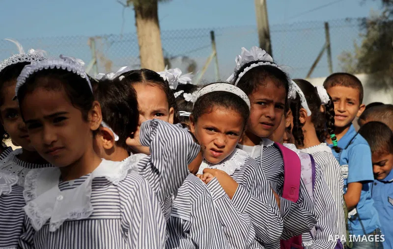 Palestinian students return back to their schools "UNRWA" in the morning of the first day of the new year study in Gaza city on Sep. 02, 2012. The academic year began in the Gaza Strip and West Bank on Sept. 02. Photo by...