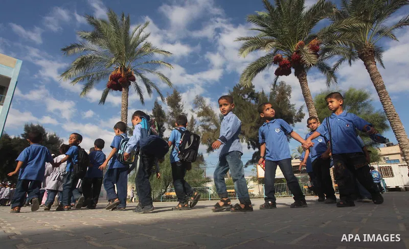 Palestinian students return back to their schools "UNRWA" in the morning of the first day of the new year study in Gaza city on Sep. 02, 2012. The academic year began in the Gaza Strip and West Bank on Sept. 02. Photo by...