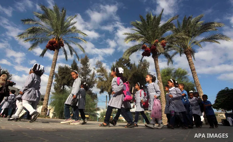 Palestinian students return back to their schools "UNRWA" in the morning of the first day of the new year study in Gaza city on Sep. 02, 2012. The academic year began in the Gaza Strip and West Bank on Sept. 02. Photo by...