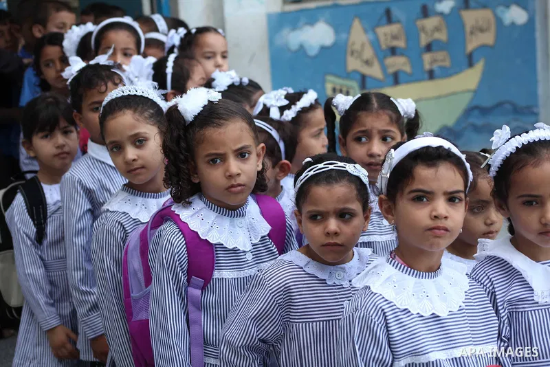Palestinian students return back to their schools "UNRWA" in the morning of the first day of the new year study in Gaza city on Sep. 02, 2012. The academic year began in the Gaza Strip and West Bank on Sept. 02. Photo by...