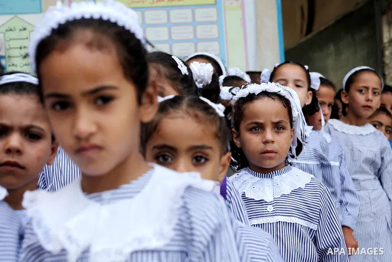 Palestinian students return back to their schools "UNRWA" in the morning of the first day of the new year study in Gaza city on Sep. 02, 2012. The academic year began in the Gaza Strip and West Bank on Sept. 02. Photo by...
