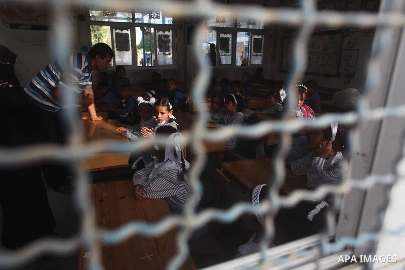 Palestinian students return back to their schools "UNRWA" in the morning of the first day of the new year study in Gaza city on Sep. 02, 2012. The academic year began in the Gaza Strip and West Bank on Sept. 02. Photo by...