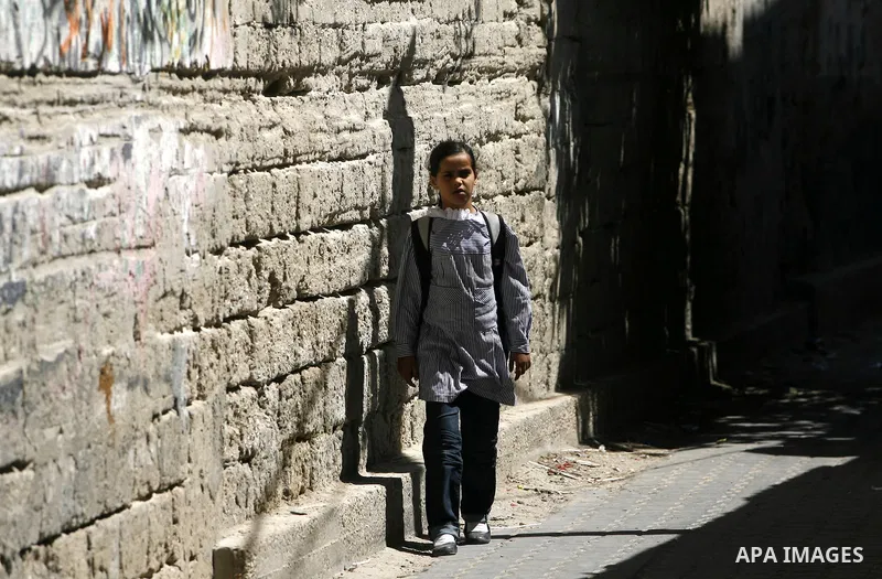 Palestinian students return back to their schools in the morning of the first day of the new year study in Rafah in the southern Gaza Strip. 02, 2012. The academic year began in the Gaza Strip and West Bank on Sept. 02....