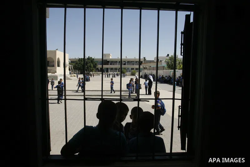 Palestinian students return back to their schools in the morning of the first day of the new year study in Rafah in the southern Gaza Strip. 02, 2012. The academic year began in the Gaza Strip and West Bank on Sept. 02....
