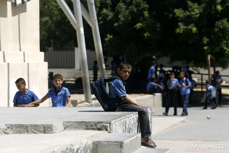 Palestinian students return back to their schools in the morning of the first day of the new year study in Rafah in the southern Gaza Strip. 02, 2012. The academic year began in the Gaza Strip and West Bank on Sept. 02....