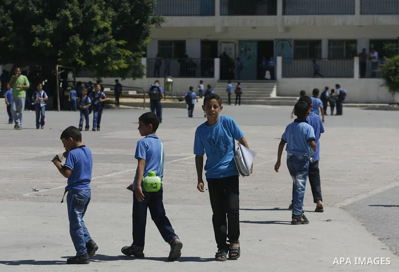 Palestinian students return back to their schools in the morning of the first day of the new year study in Rafah in the southern Gaza Strip. 02, 2012. The academic year began in the Gaza Strip and West Bank on Sept. 02....