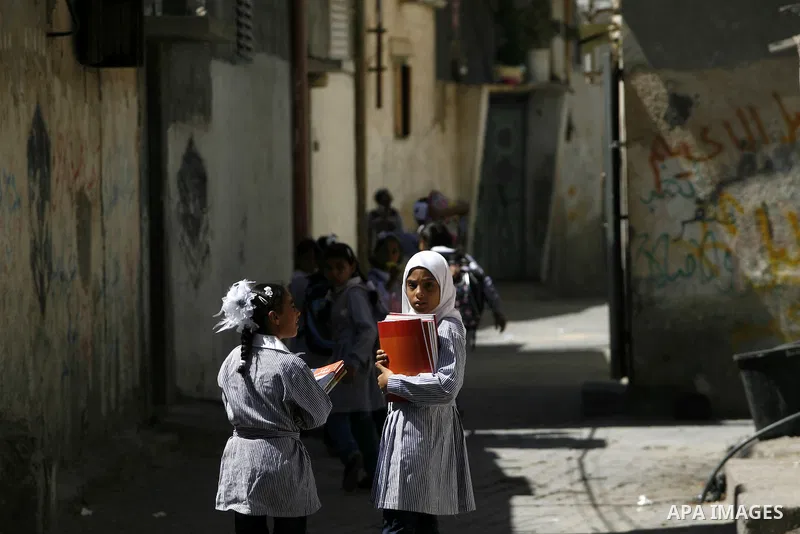 Palestinian students return back to their schools in the morning of the first day of the new year study in Rafah in the southern Gaza Strip. 02, 2012. The academic year began in the Gaza Strip and West Bank on Sept. 02....