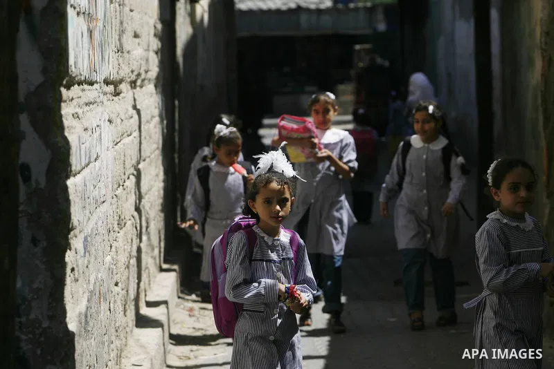 Palestinian students return back to their schools in the morning of the first day of the new year study in Rafah in the southern Gaza Strip. 02, 2012. The academic year began in the Gaza Strip and West Bank on Sept. 02....