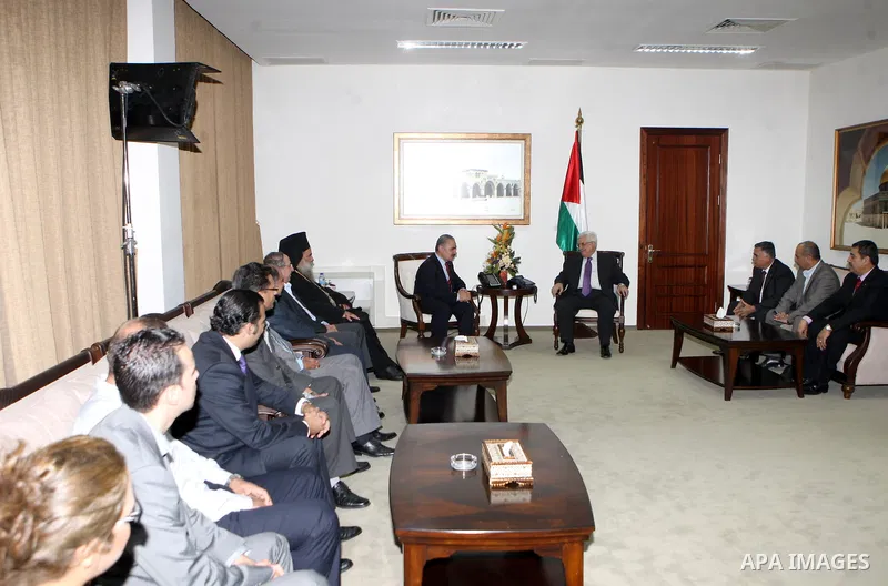 Palestinian President Mahmoud Abbas (Abu Mazen) meets with members campaign Relief in Syria in the West Bank city of Ramallah, on Sep. 02, 2012. Photo by Thaer Ganaim