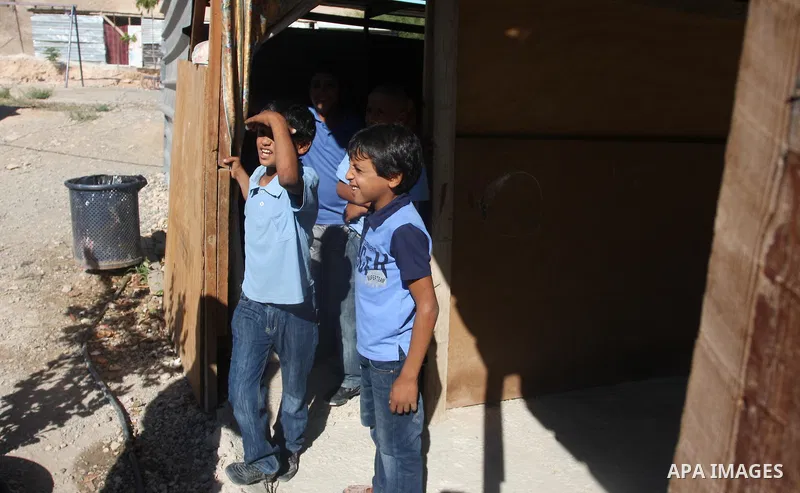 Palestinian students at their school during the visit of Palestinian Prime Minister Salam Fayyad to the "al-Khan al-Ahmar" school, on the first day of the new school year, in Abu Hindi valley in the bedouin, in occupied...