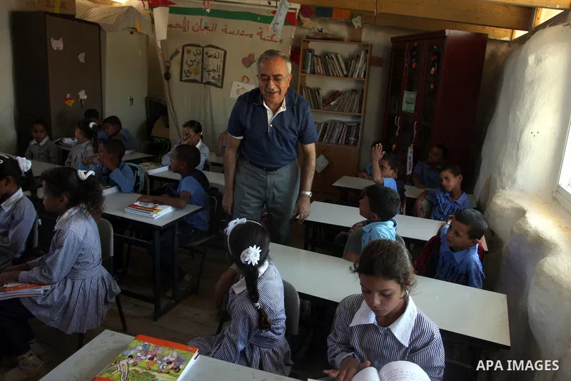 Palestinian Prime Minister Salam Fayyad visits the school "al-Khan al-Ahmar", on the first day of the new school year, in Abu Hindi valley in the bedouin, in occupied West Bank near Jericho, on September 2, 2012. Photo b...