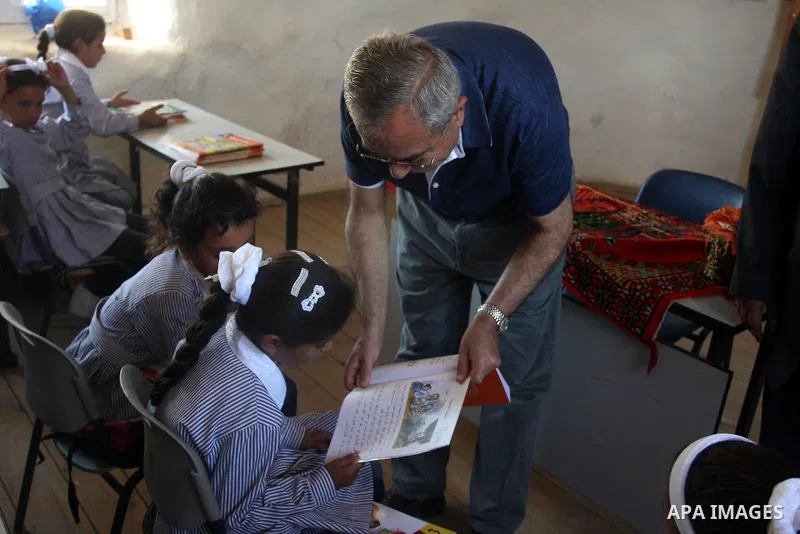 Palestinian Prime Minister Salam Fayyad visits the school "al-Khan al-Ahmar", on the first day of the new school year, in Abu Hindi valley in the bedouin, in occupied West Bank near Jericho, on September 2, 2012. Photo b...