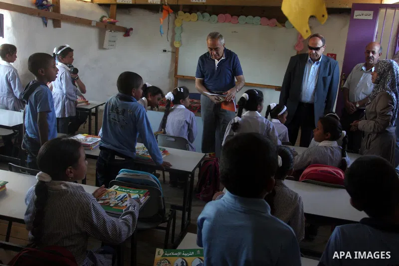 Palestinian Prime Minister Salam Fayyad visits the school "al-Khan al-Ahmar", on the first day of the new school year, in Abu Hindi valley in the bedouin, in occupied West Bank near Jericho, on September 2, 2012. Photo b...