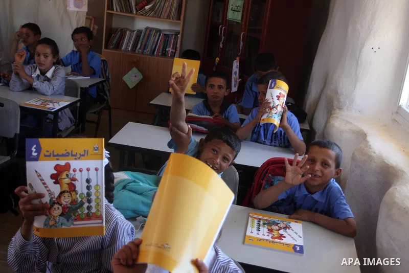 Palestinian students at their school during the visit of Palestinian Prime Minister Salam Fayyad to the "al-Khan al-Ahmar" school, on the first day of the new school year, in Abu Hindi valley in the bedouin, in occupied...
