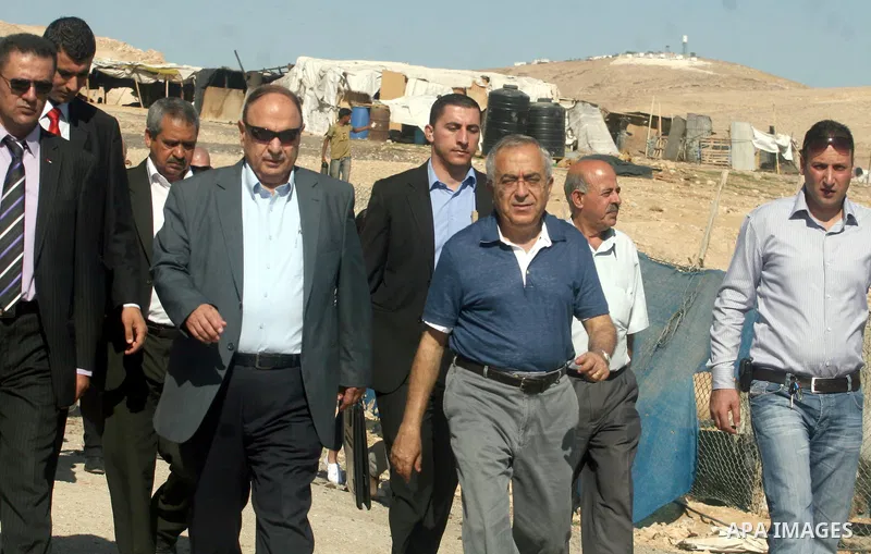 Palestinian Prime Minister Salam Fayyad visits the school "al-Khan al-Ahmar", on the first day of the new school year, in Abu Hindi valley in the bedouin, in occupied West Bank near Jericho, on September 2, 2012. Photo b...