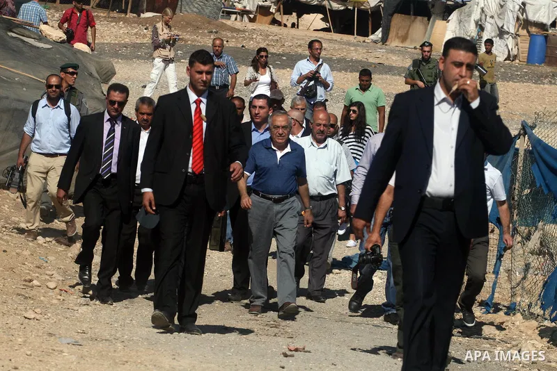 Palestinian Prime Minister Salam Fayyad visits the school "al-Khan al-Ahmar", on the first day of the new school year, in Abu Hindi valley in the bedouin, in occupied West Bank near Jericho, on September 2, 2012. Photo b...