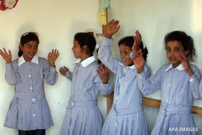 Palestinian students at their school during the visit of Palestinian Prime Minister Salam Fayyad to the "al-Khan al-Ahmar" school, on the first day of the new school year, in Abu Hindi valley in the bedouin, in occupied...